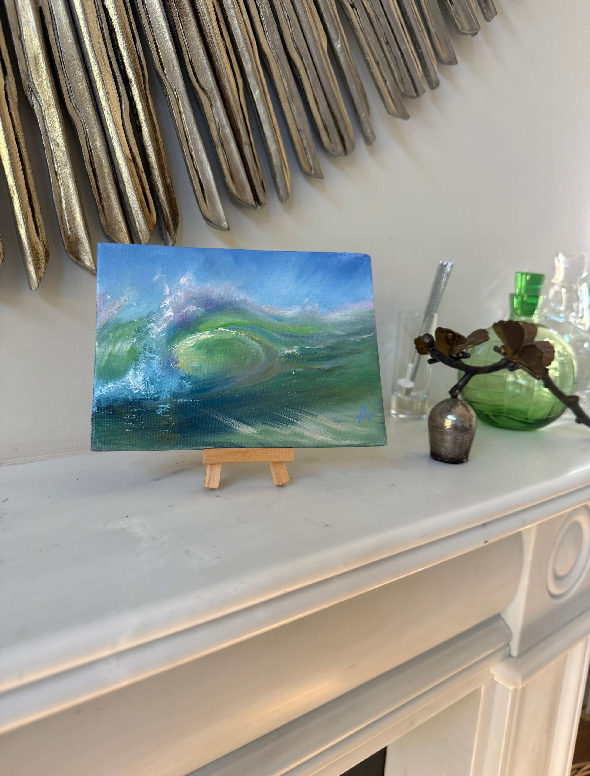 Green wave painting in the interior. Small seascape.