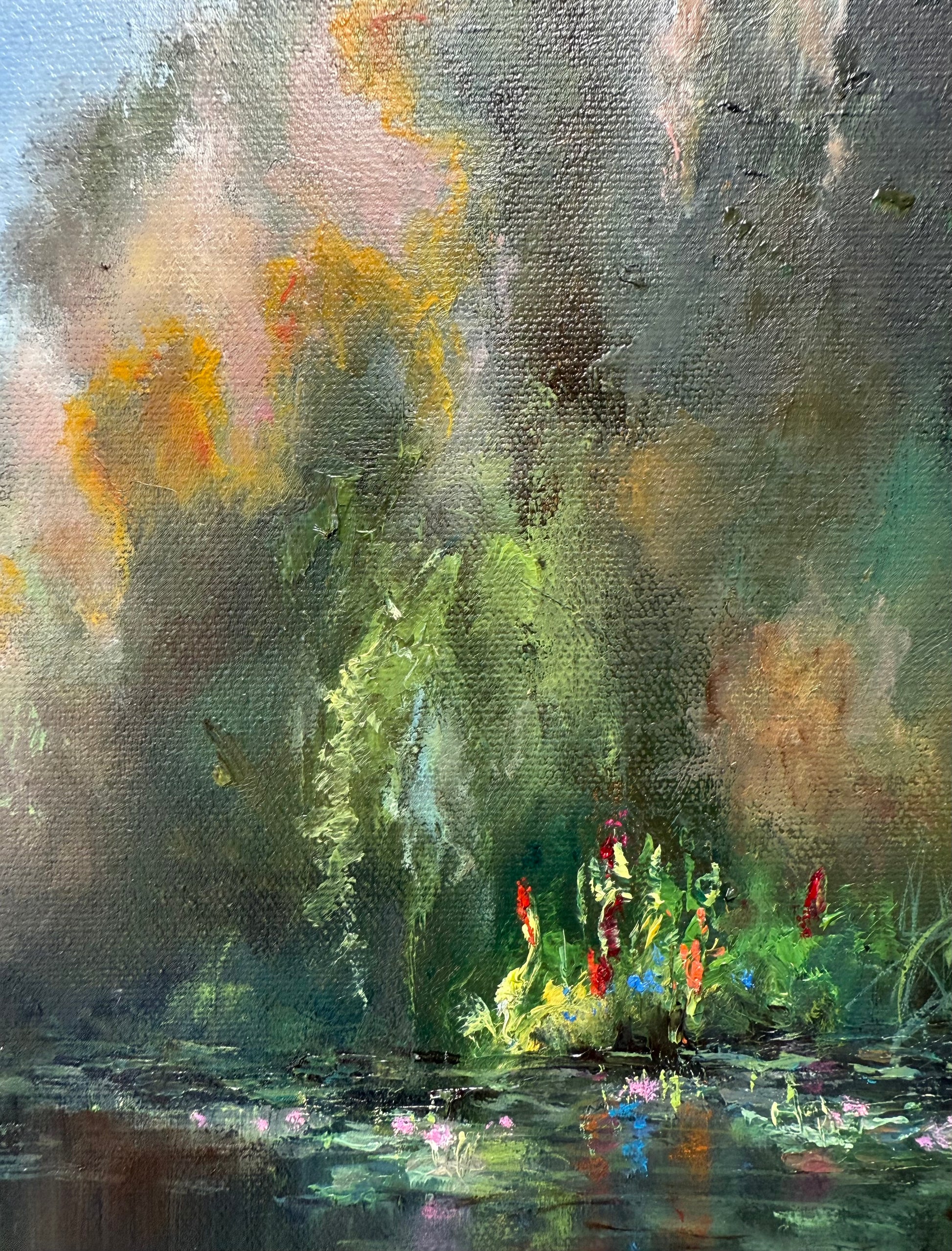 Close up of a lily pond painting , showing sunlight coming through the top of the trees near the pond.