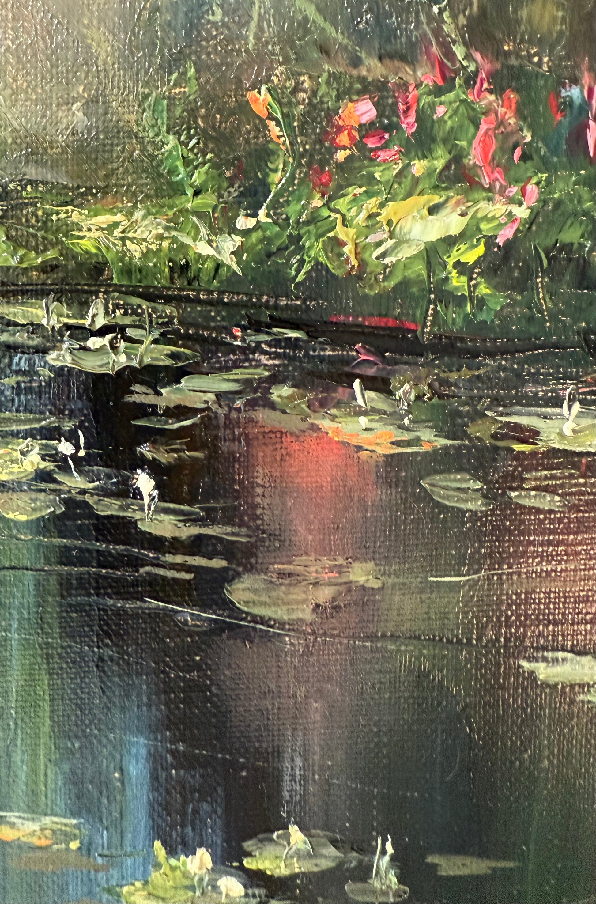 Close up of the lily pond painting showing lilies flowers and pads and grassy banks.