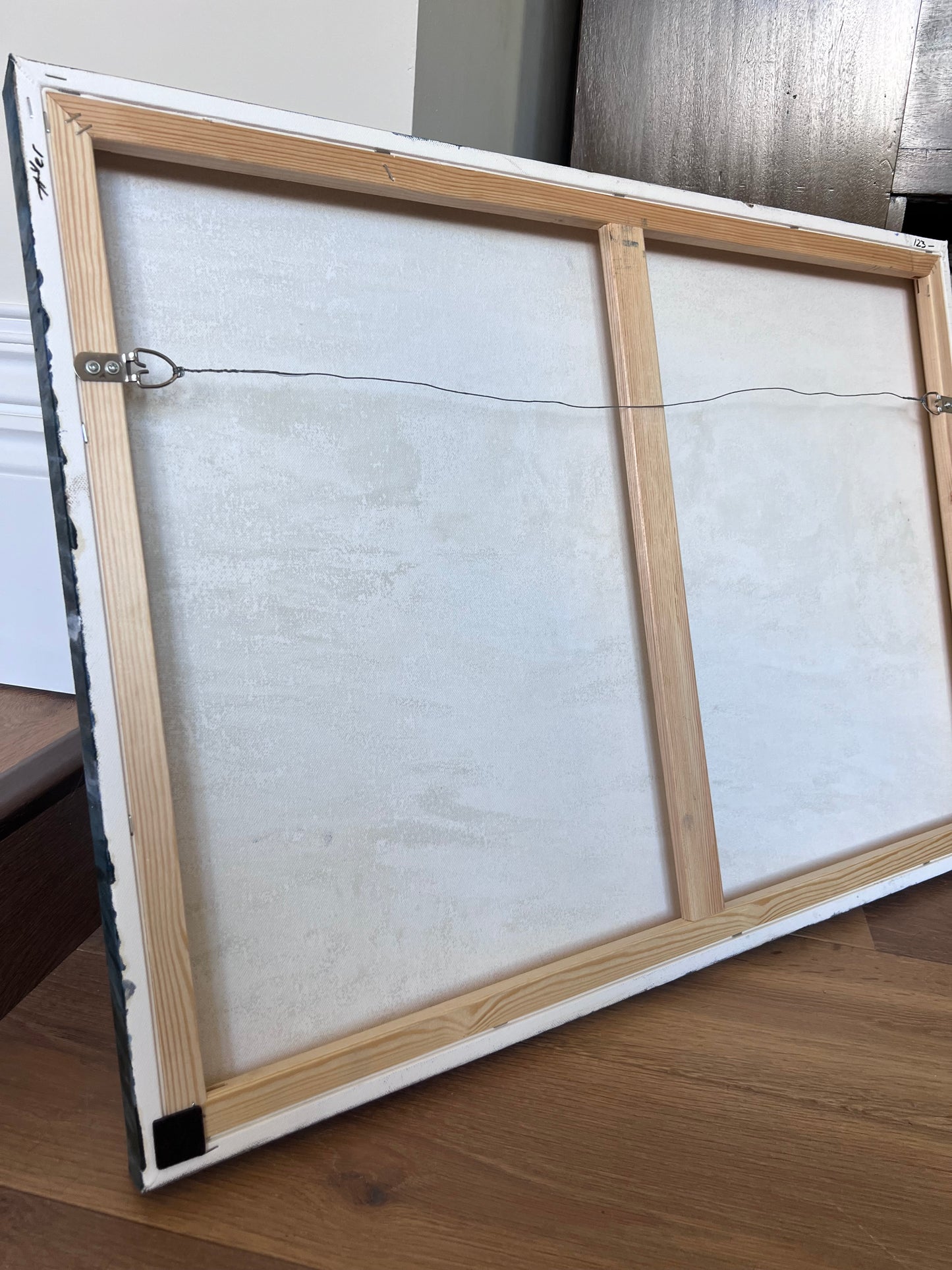 back of the painting with metal wire attached - ready to hang