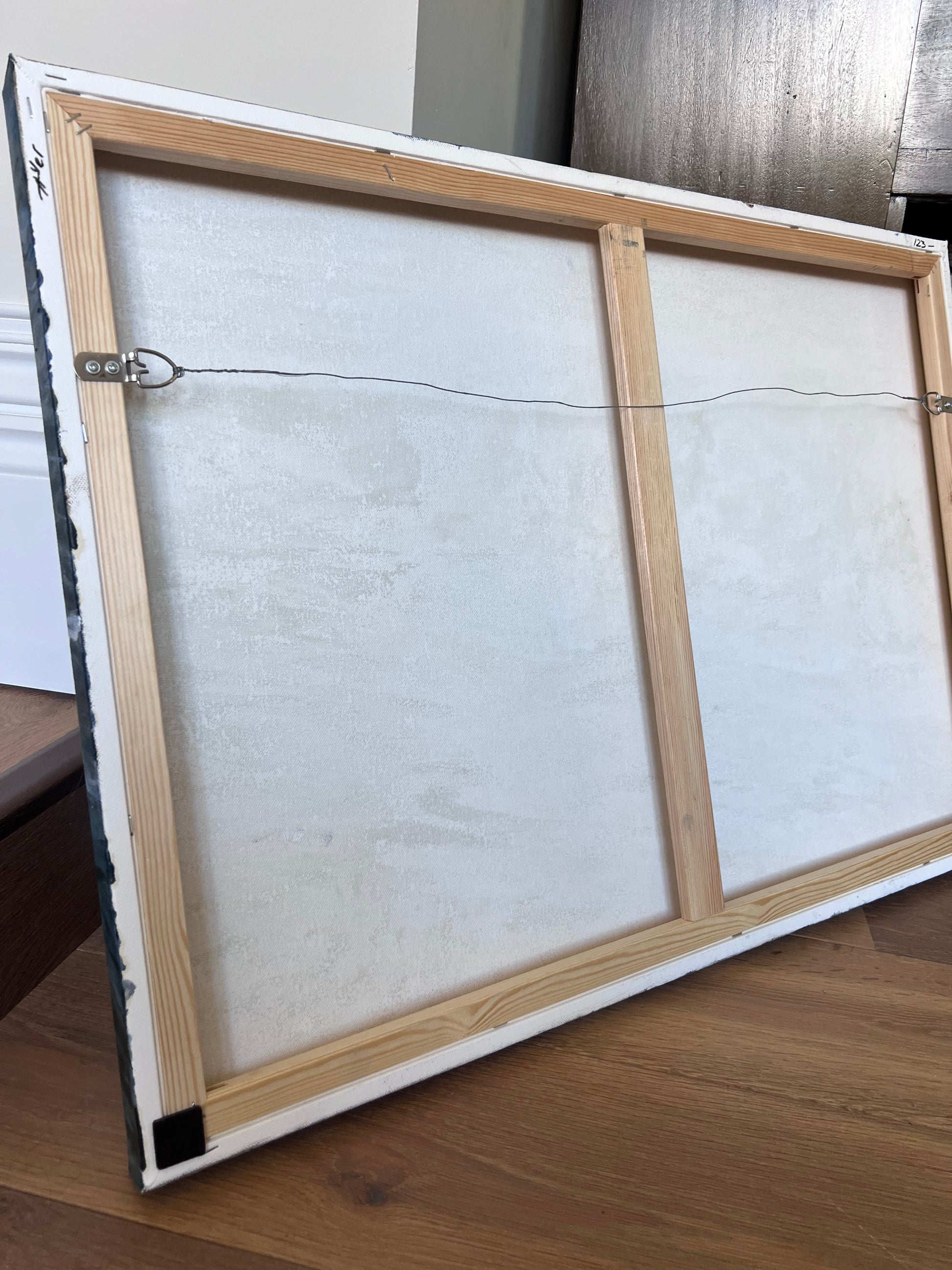 back of the painting with metal wire attached - ready to hang