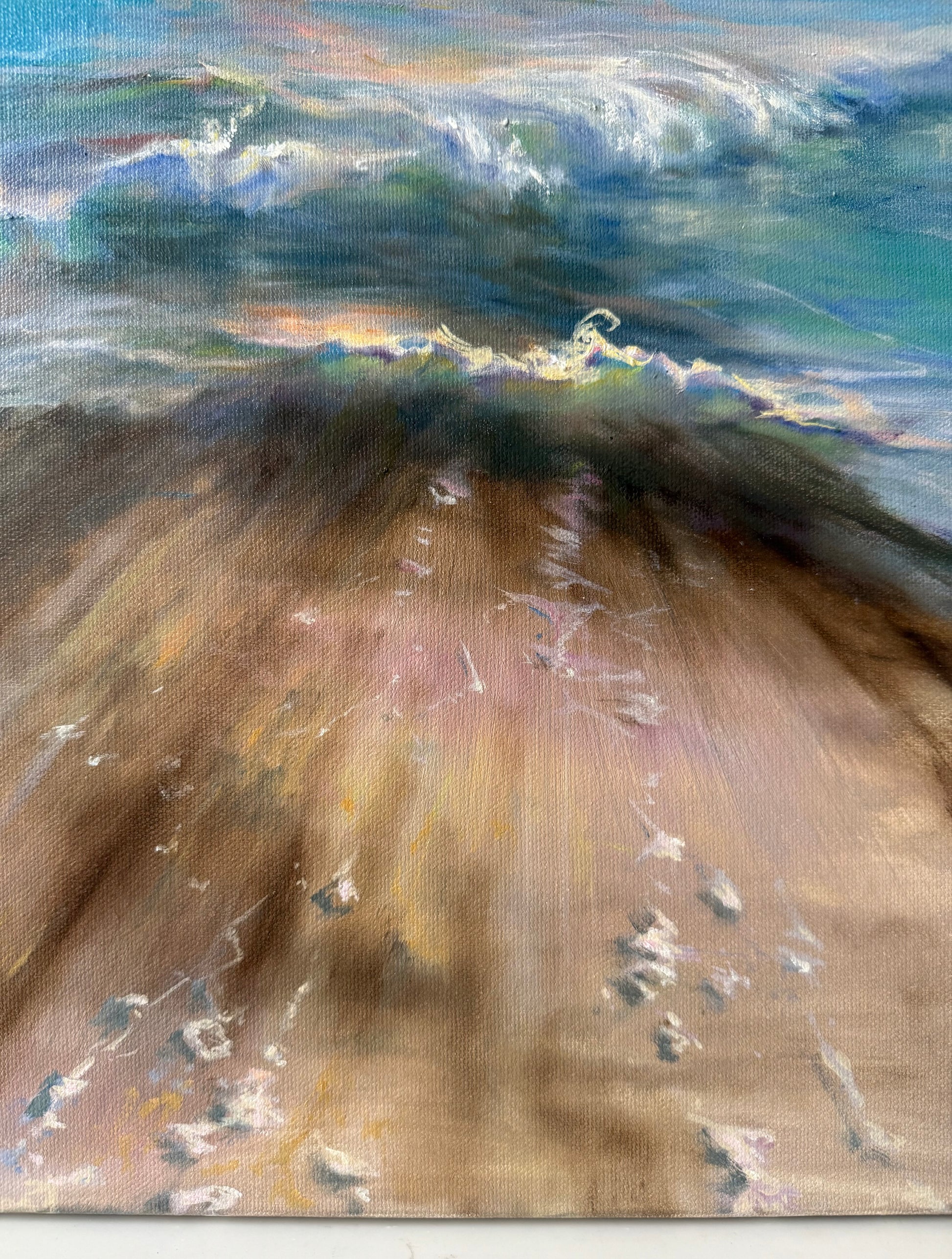 Crystal clear tide water with bits of sea foam