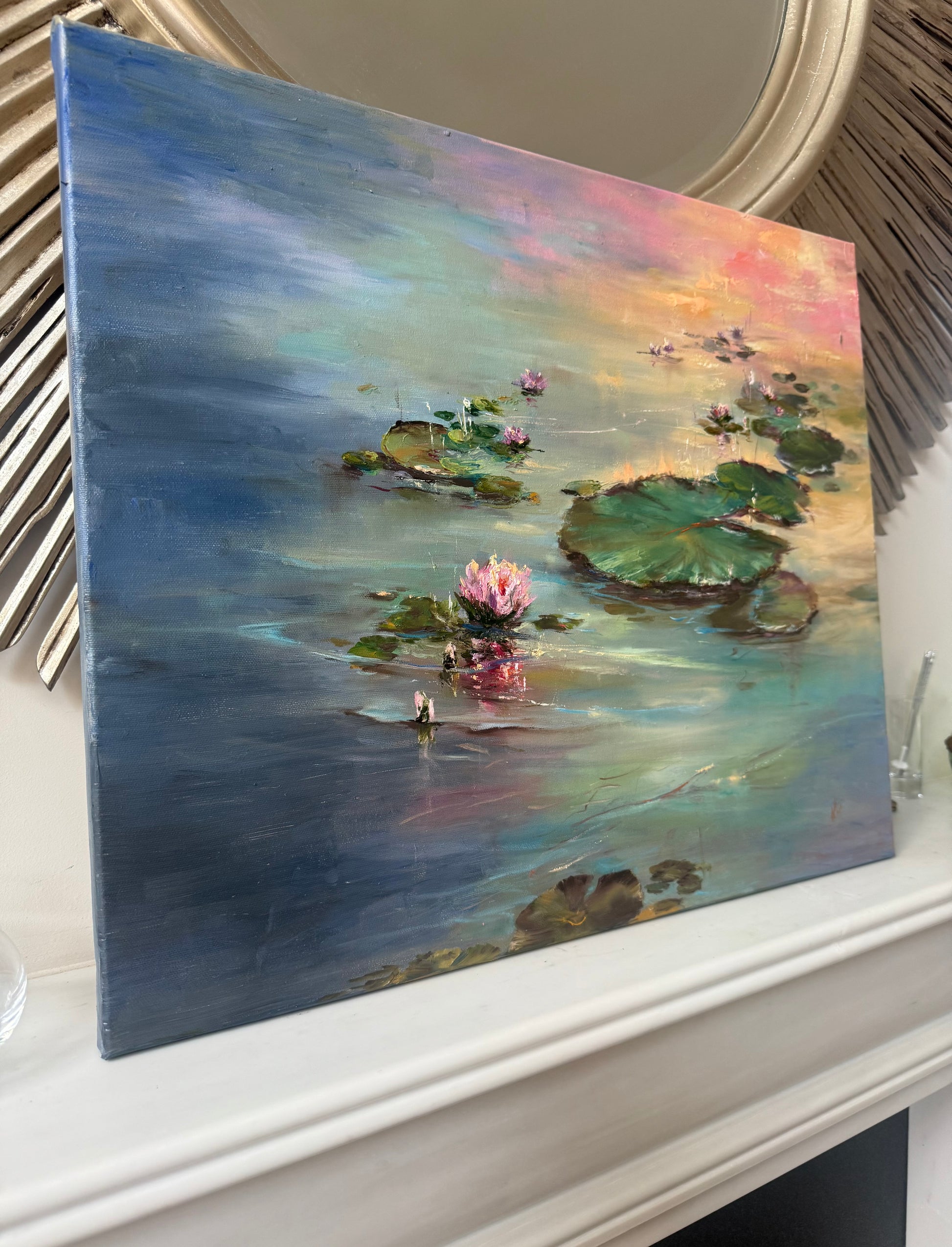 Painting of a serene pond scene with lily flowers and pads on a teal and pink water surface.
