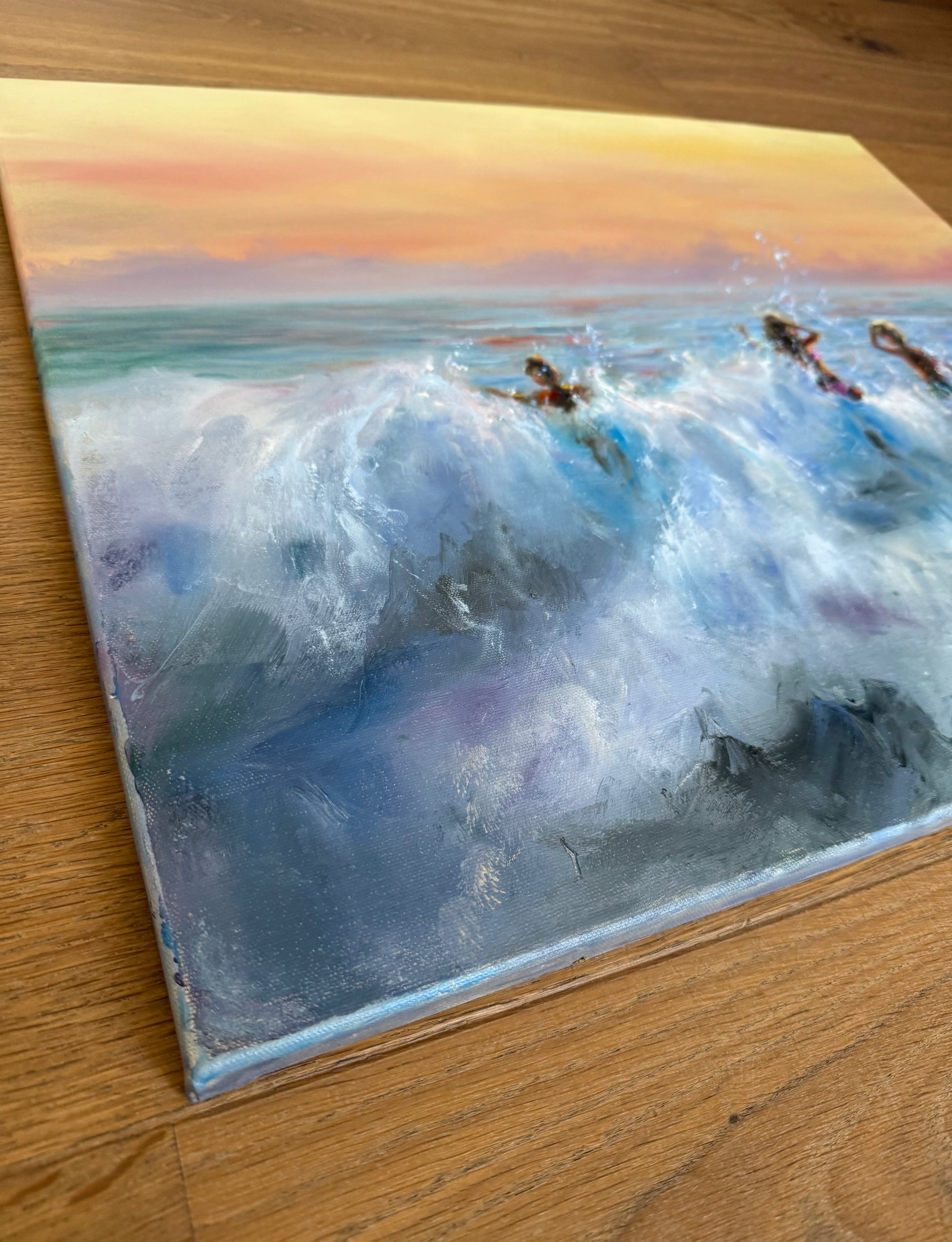 Ocean wave oil painting, showing the family of 3 people jumping in waves at golden sunset time.