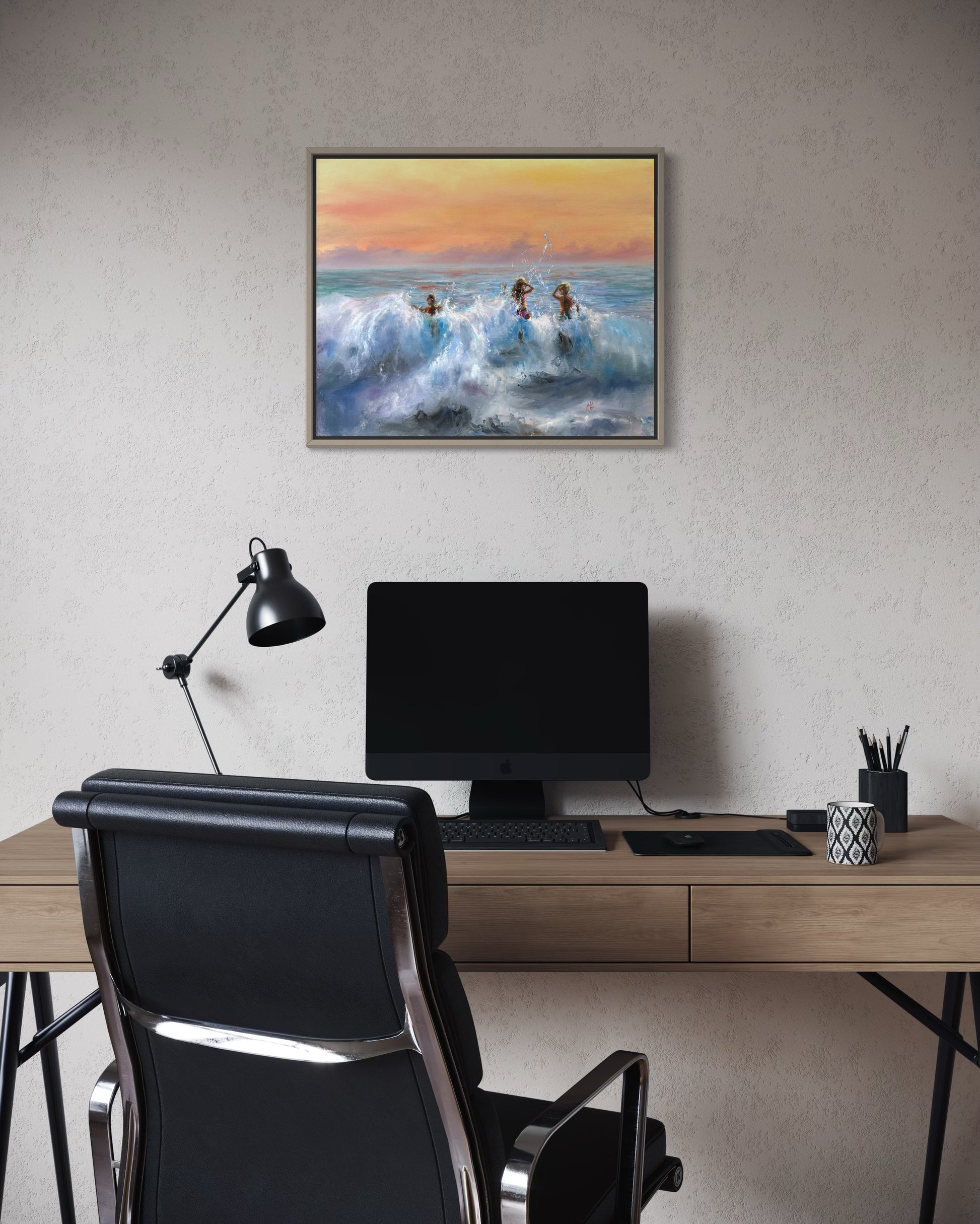 Seascape hanging on the wall above the desk top.