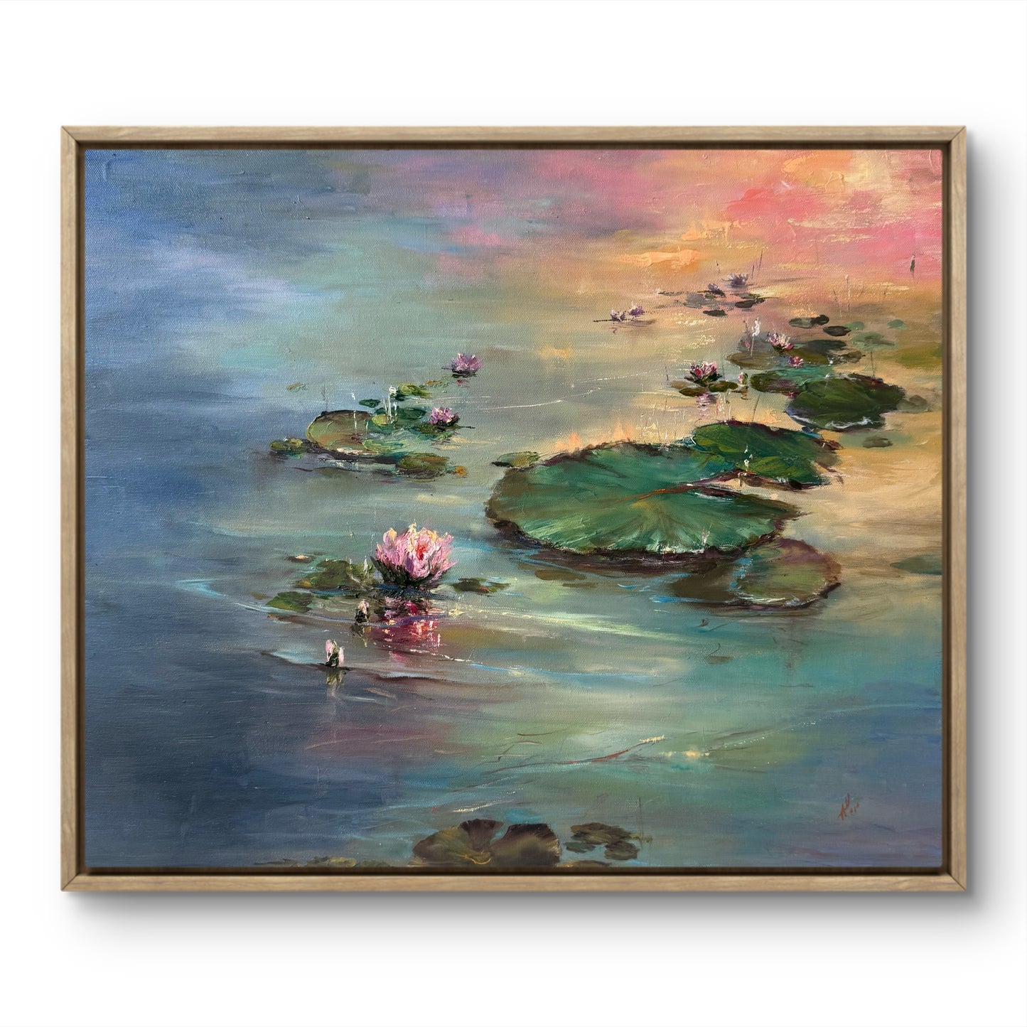Framed painting of water lilies on a pond with a colorful sunrise sky reflections.