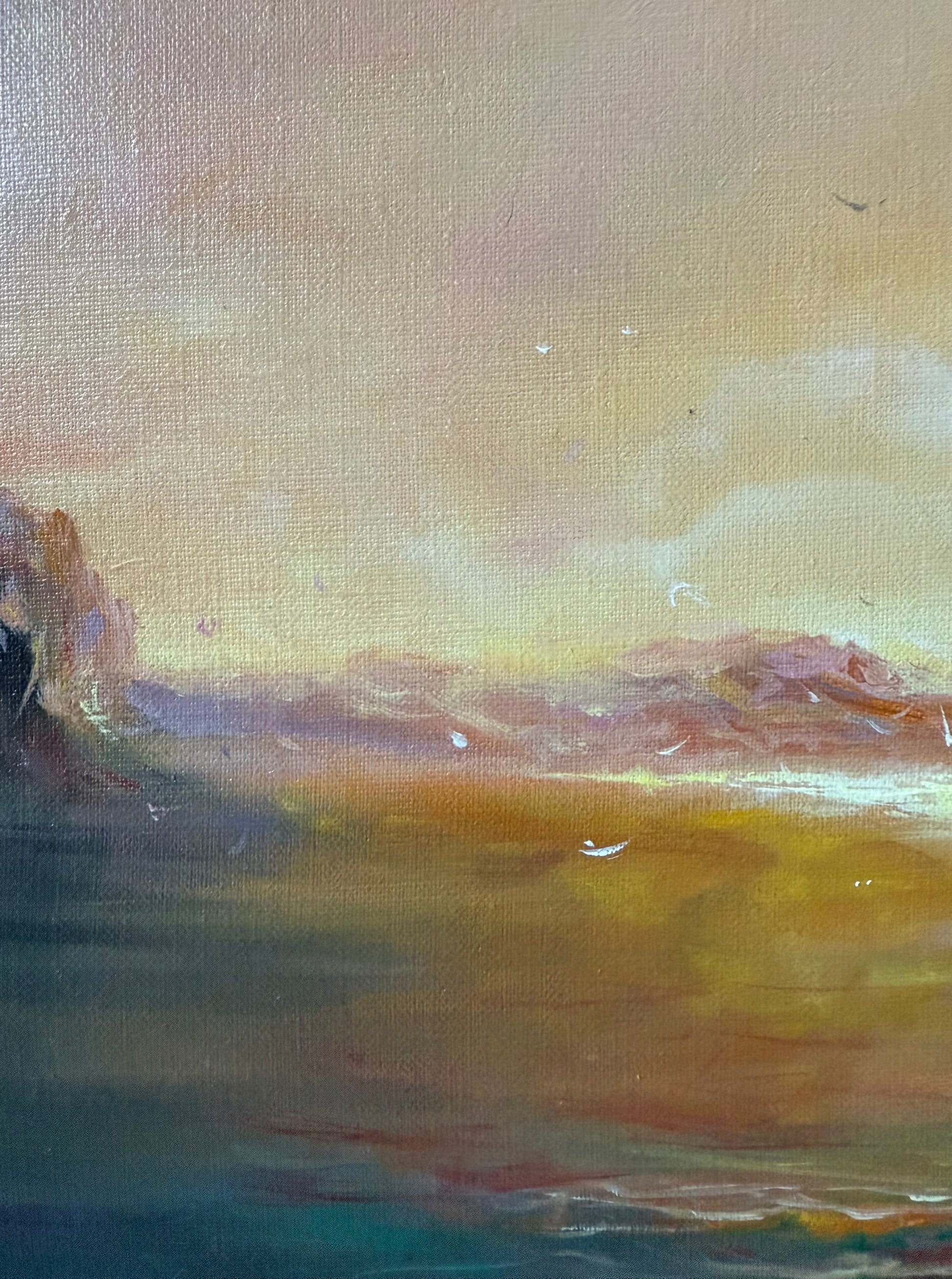 Close up of a seascape featuring golden mist over sea