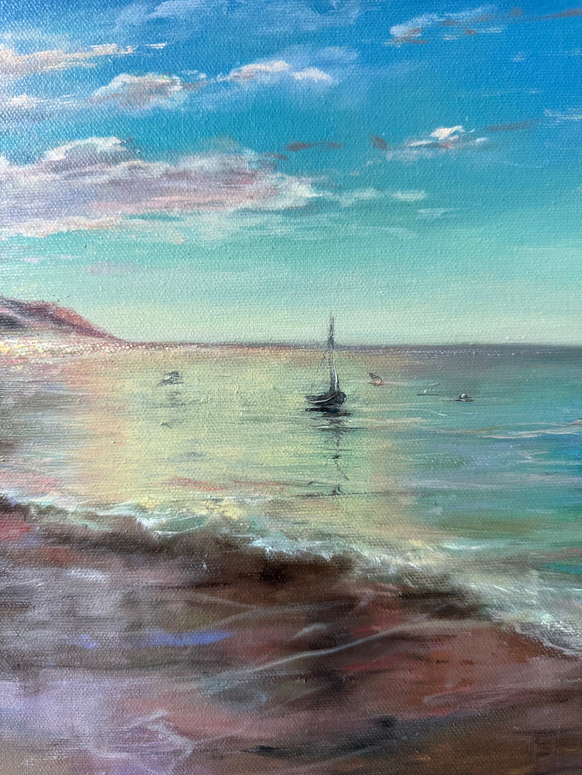 Close up of a Painting showing  sailboat on the water with a colourful sky and clouds.