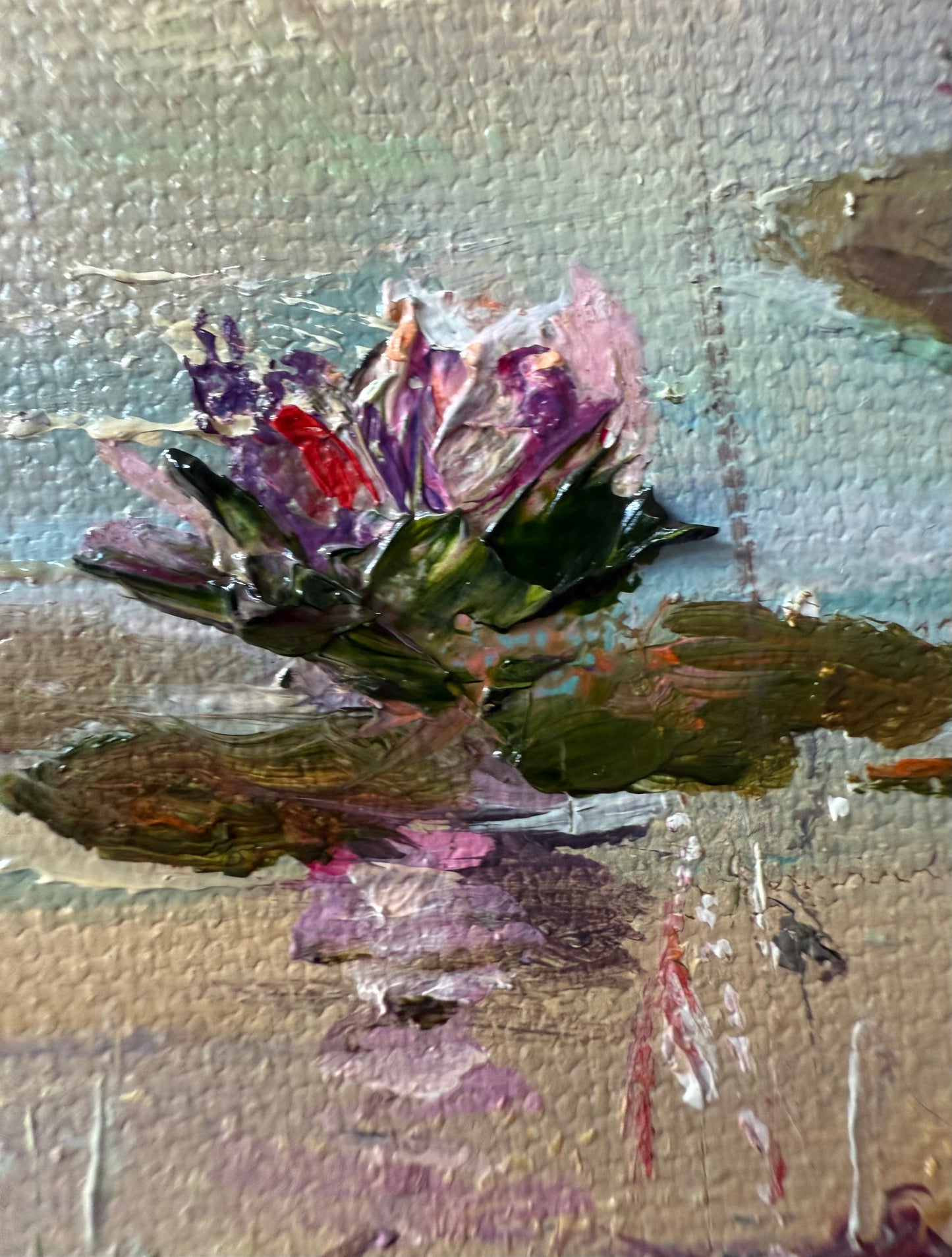 Close-up of a painting of a lily flower with textured paint.