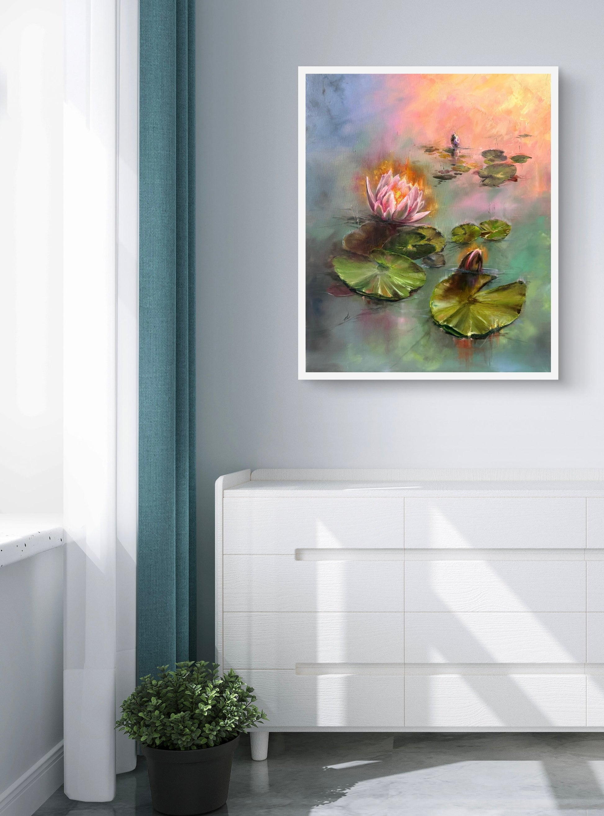 Lily pond painting framed in white frame hanging on the wall above the white chest of drawers.