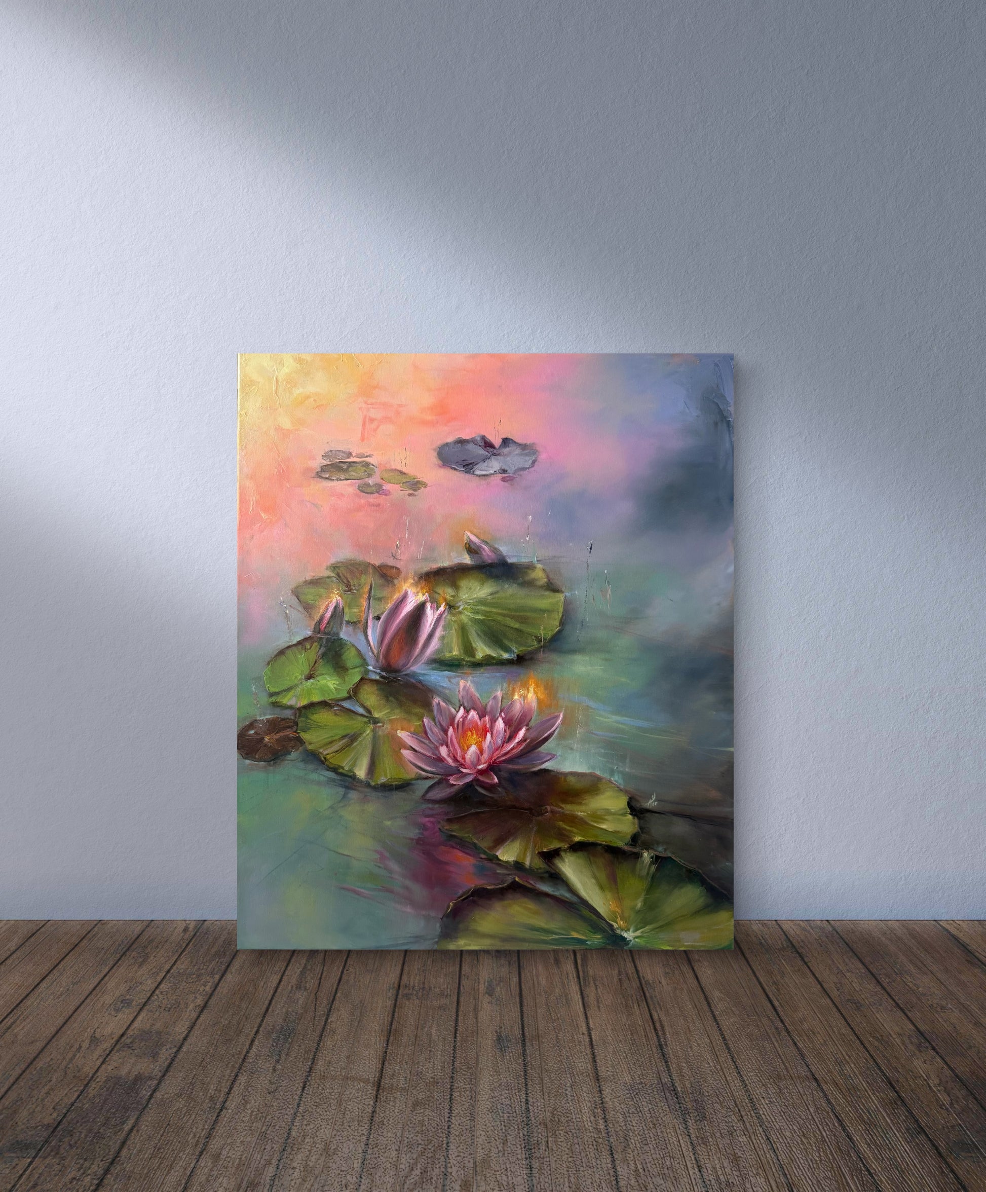 Colorful painting of water lilies on a wall with wooden floor and gray wall.
