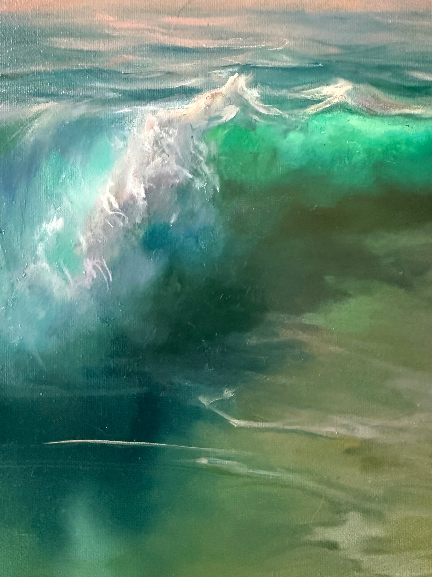 Close-up of a wave with water droplets on a beach