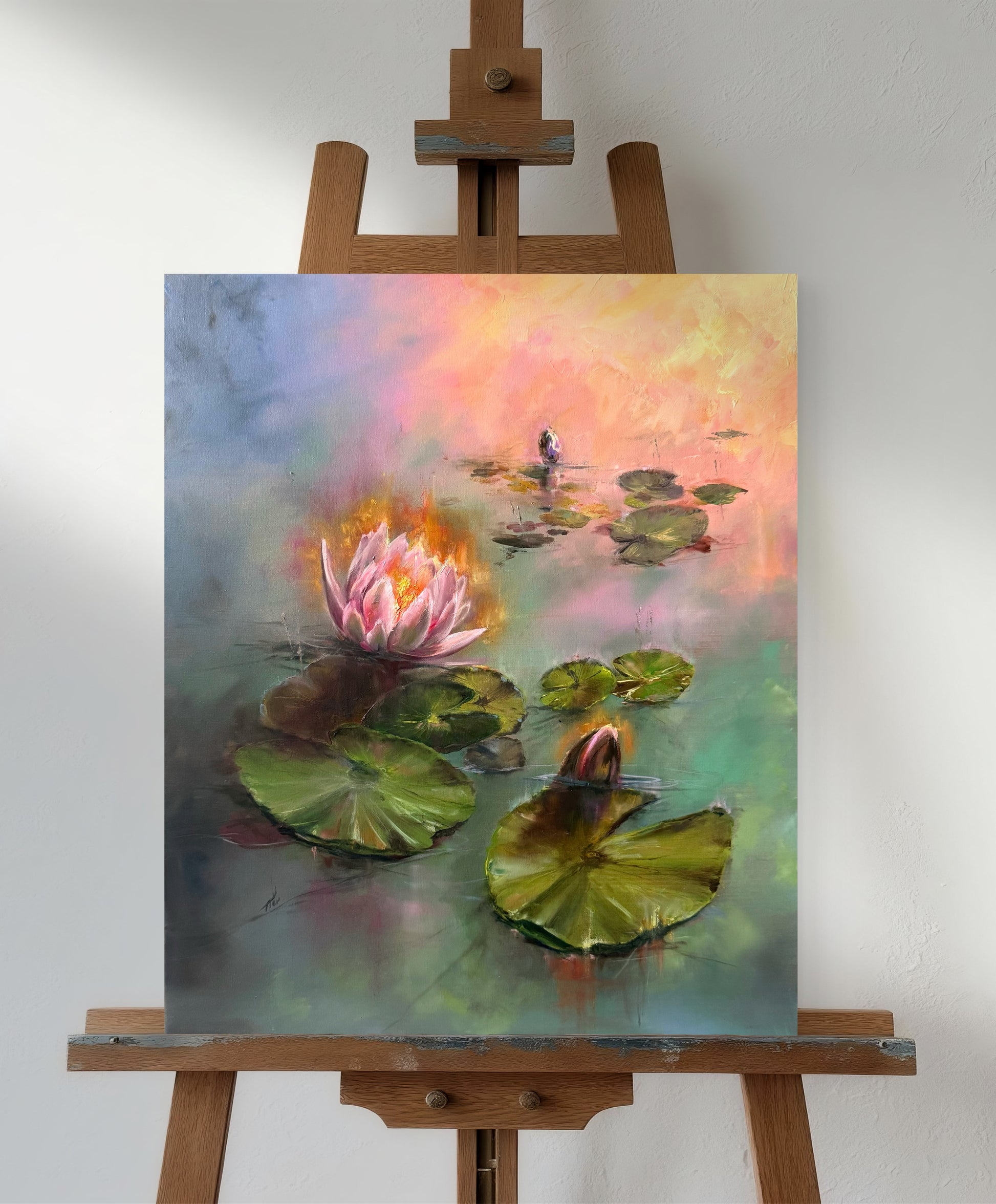 Water lilies at sunrise standing on the easel. 