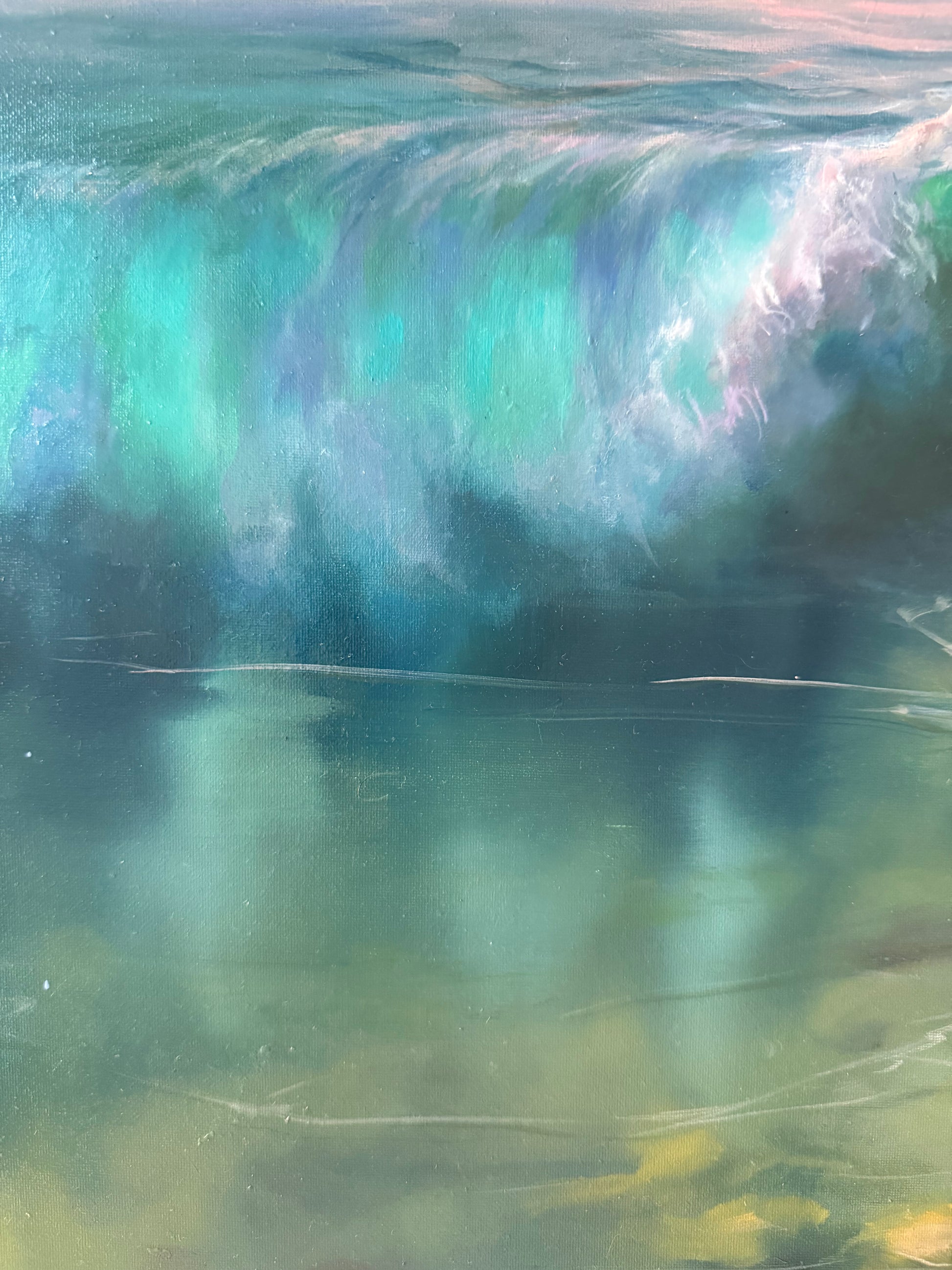 Close-up of a large wave with a gradient of blue and green colors.