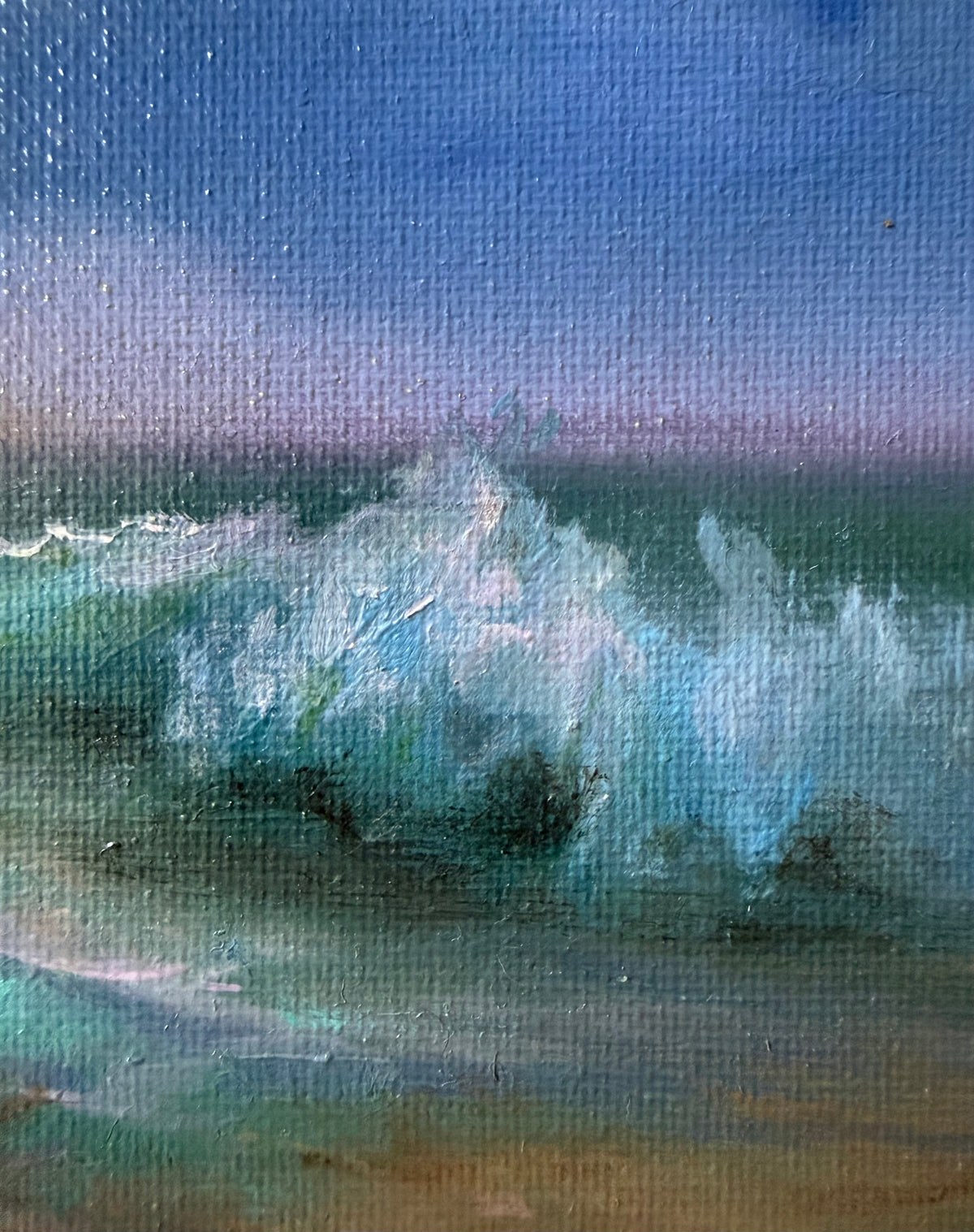 A close-up of a painted ocean wave scene on canvas, showing blue and green water with white foam and a soft purple-blue sky.