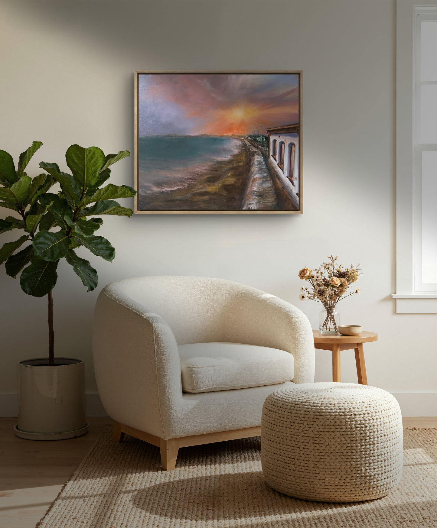 Seascape on the wall above the beige chair. 