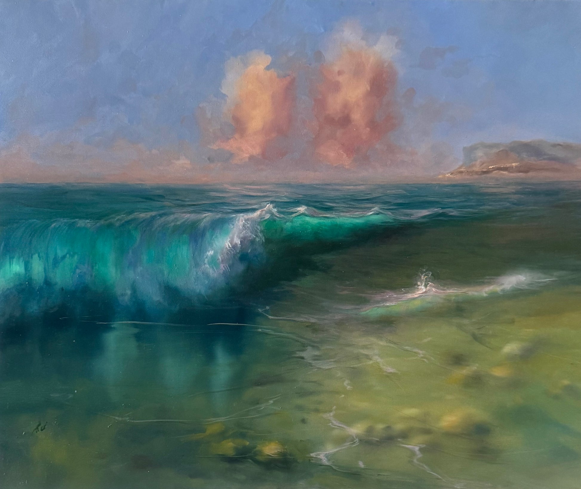 Seascape with clear rolling waves and golden clouds above the sea