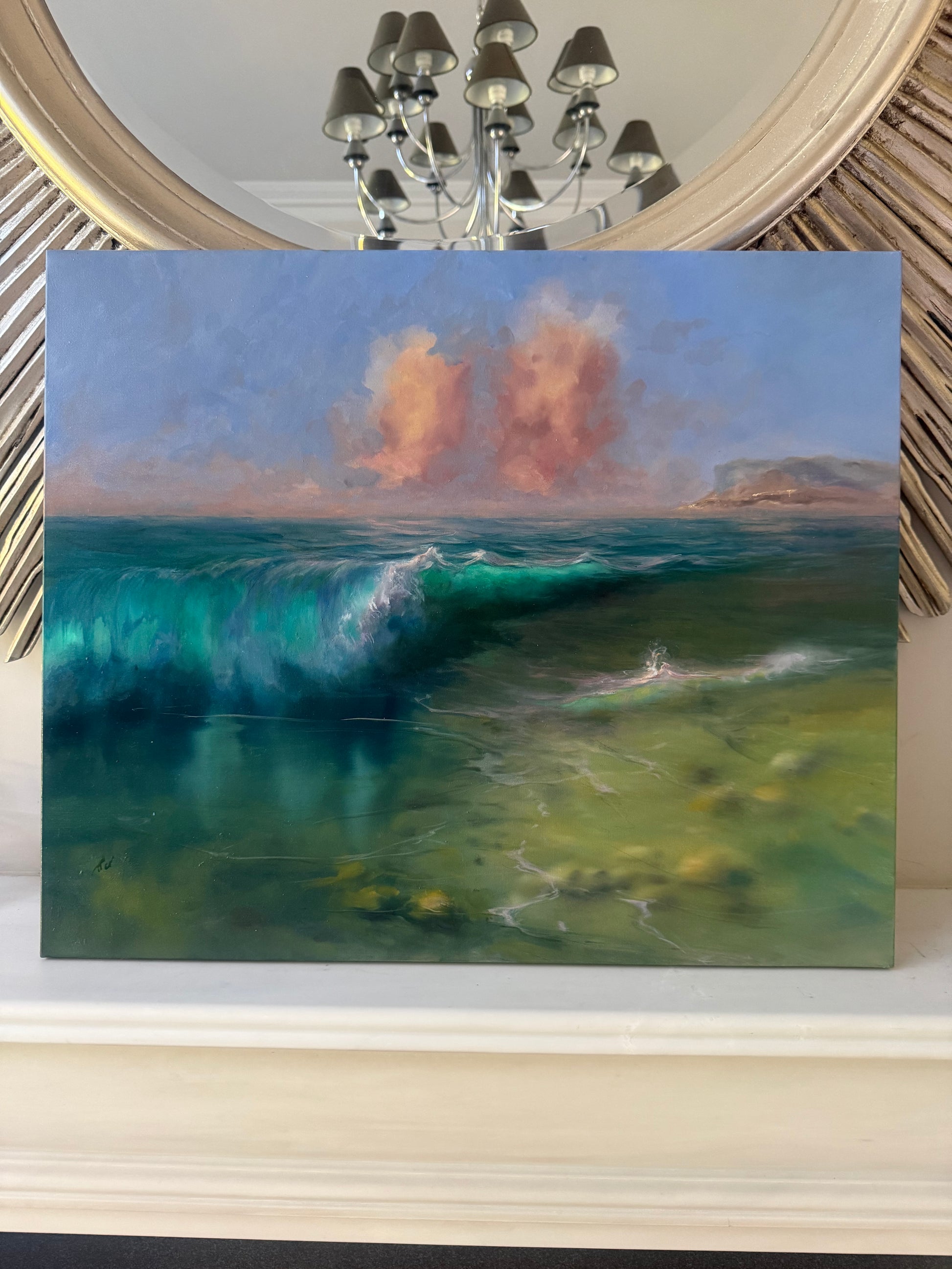 Seascape painting standing above fireplace 