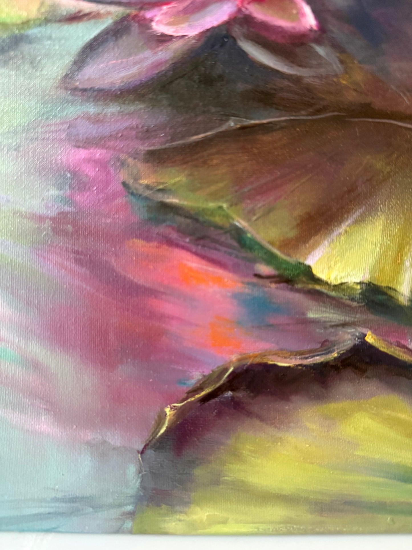 Close-up of a colourful lily pond painting with pink, green, and yellow hues.